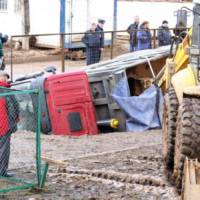 Giant pothole swallows three cars and a truck