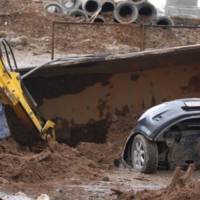 Giant pothole swallows three cars and a truck