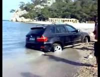 BMW X5 buried in Turkish beach sand
