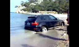 BMW X5 buried in Turkish beach sand