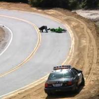 Video: Biker lowsides infront of Police