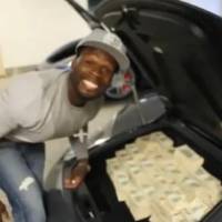 Video: 50 Cent stacks 2 Million USD in his Lambo