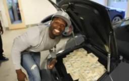 Video: 50 Cent stacks 2 Million USD in his Lambo