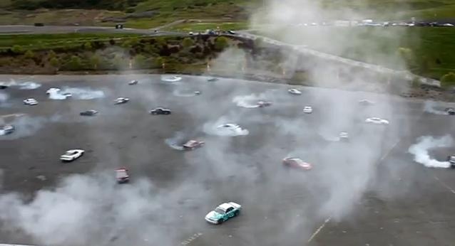 World Record: 75 Cars Simultaneously Doing Donuts