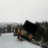 Semi-Trailer Drags Tow Truck Off Snowy Cliff