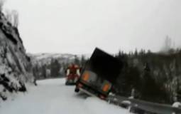 Semi-Trailer Drags Tow Truck Off Snowy Cliff