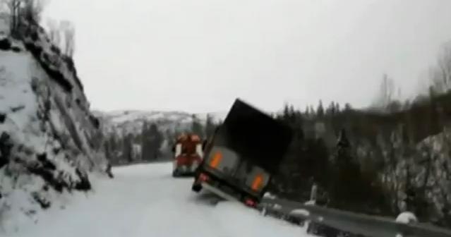 Semi-Trailer Drags Tow Truck Off Snowy Cliff