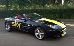 Chris Froome receives a Jaguar F-Type