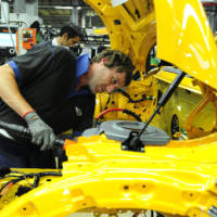 First Mini five-door hatchback rolls off the assembly line in Oxford