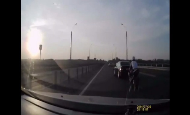 The luckiest biker on the planet - He rear-ended a car and landed on its feet on the moving vehicle