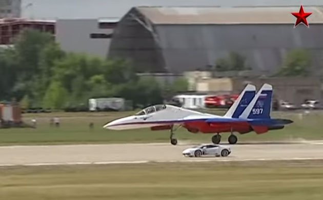 Lamborghini Huracan battles a Sukhoi jet fighter