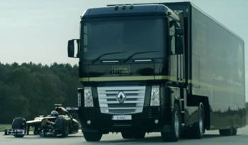 Lotus F1 Team truck jumps over Formula 1 car