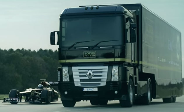 Lotus F1 Team truck jumps over Formula 1 car