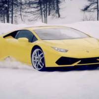 Lamborghini Huracan racing a snowmobile