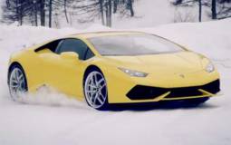 Lamborghini Huracan racing a snowmobile