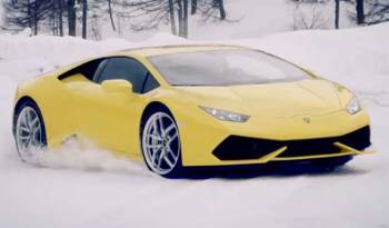 Lamborghini Huracan racing a snowmobile