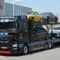 MAN truck in Martini Racing livery for transporting Porsche cars