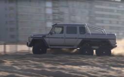 Mercedes G63 AMG 6x6 power sliding on a Belgium beach
