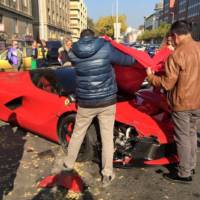 Ferrari LaFerrari hits three parked cars